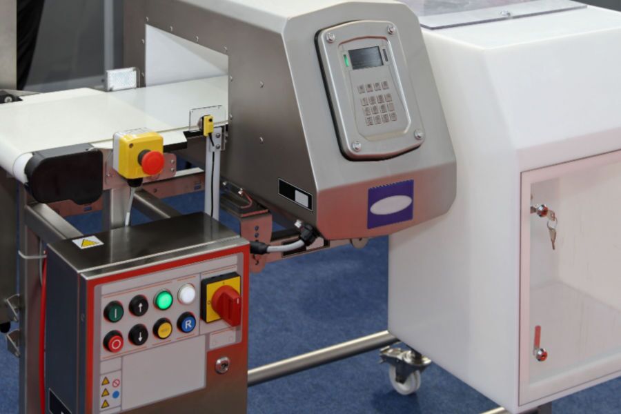metal detector at production line in food factory