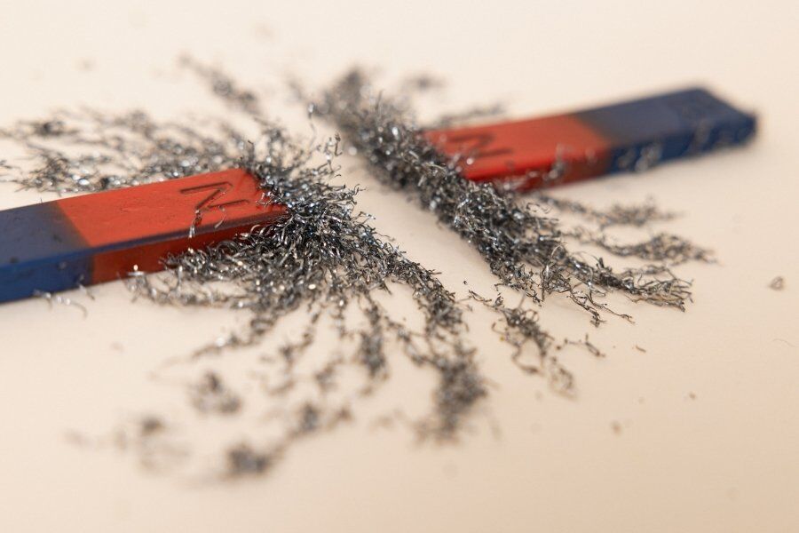 two magnets attracting metals